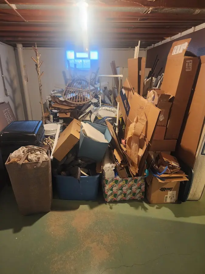 Roll-off dumpster container at job site for Yard Waste Dumpster Rental in Wolcott